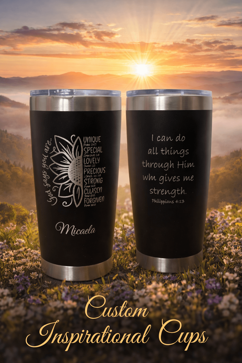 Two black custom tumblers with inspirational engravings set against a scenic mountain sunrise background.